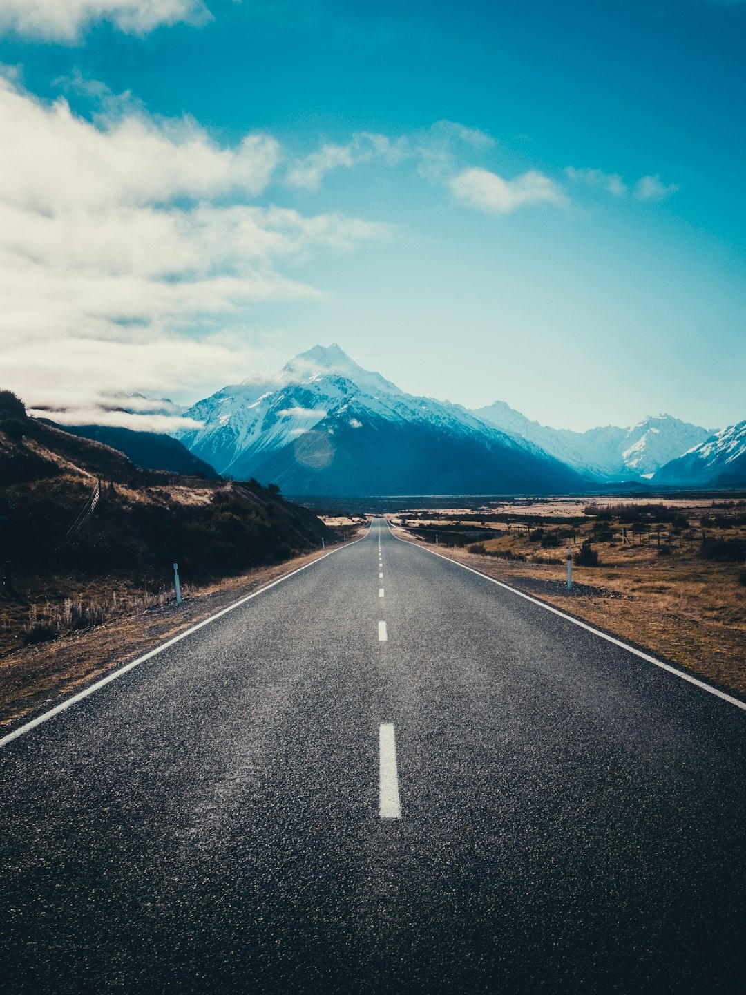 road near mountain during daytime